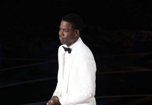Chris Rock in a white suit