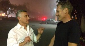 Adam Leipzig talks to a man