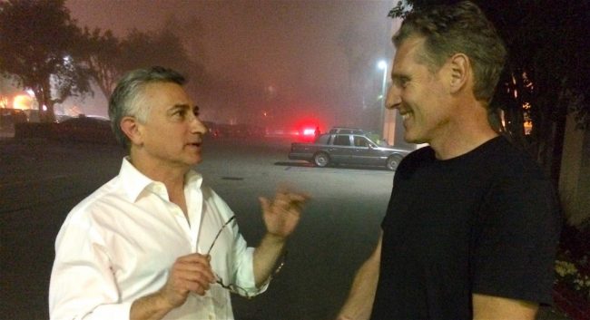 Adam Leipzig talks to a man