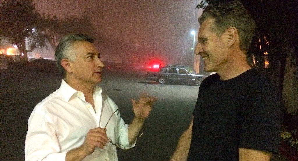 Adam Leipzig talks to a man