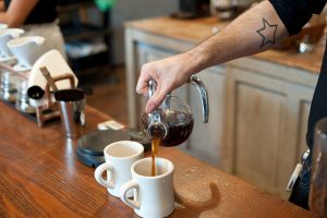Barista pouring coffee