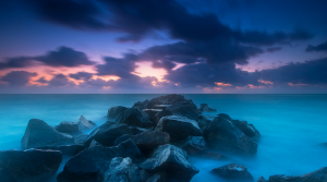 Rocks in water at sunset