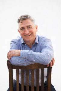 Adam Leipzig sits in chair