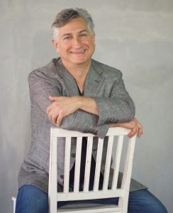 Adam Leipzig sits in chair