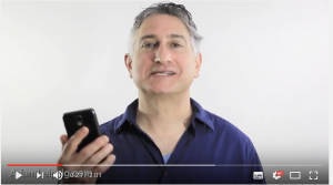 Adam Leipzig holding a phone